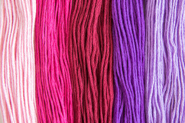 Sewing threads in different colors abstract.