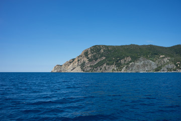 Fototapeta na wymiar Italy, Cinque Terre, Monterosso, Monterosso al Mare, SCENIC VIEW OF SEA AGAINST CLEAR BLUE SKY