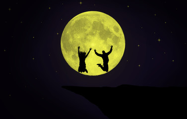 people jumping in front of full moon