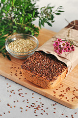 Useful home-made vegan sourdough bread from green buckwheat with flax and sunflower seeds. Raw healthy and proper nutrition