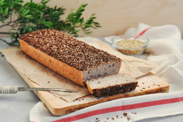 Useful home-made vegan sourdough bread from green buckwheat with flax and sunflower seeds. Raw healthy and proper nutrition