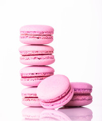 Stack of pink macaroon on a white background
