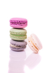 Stack of multicolored macaroon on a white background