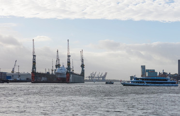 Fototapeta premium Boat with tourists goes on Elbe river in Hamburg, Germany