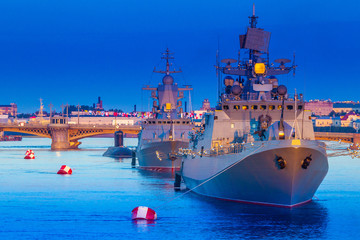 Fototapeta premium St. Petersburg. Russia. Day of the Navy of Russia. Naval parade. Military destroyers on the Neva. Bridges of St. Petersburg. Holidays of Russia. Petersburg embankments.