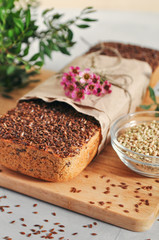 Useful home-made vegan sourdough bread from green buckwheat with flax and sunflower seeds. Raw healthy and proper nutrition