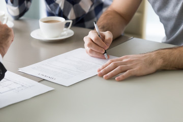 Family couple sign mortgage contract with realtor at bank meeting