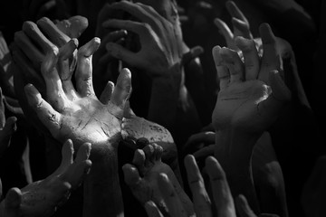 hands Raise over the dark  waiting help, hope and more.