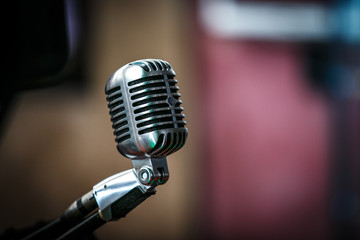 retro microphone on black background