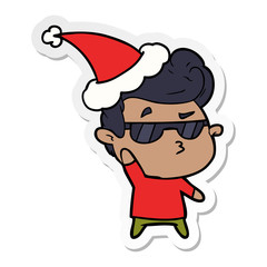 sticker cartoon of a cool guy wearing santa hat