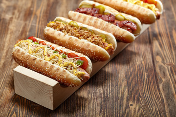 Different types of Hot Dogs With Yellow Mustard, Onion, Pickles