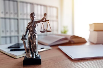 Fotobehang Lady Justice statue in law firm office © Bits and Splits