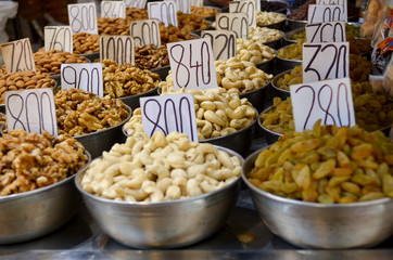 Top view of dry fruit samples nicely stacked placed in bowls and put on display in a shop in old Delhi spice market Khari Bouli, Chandni Chowk, Old Delhi, India
