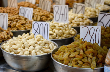 Top view of dry fruit samples nicely stacked placed in bowls and put on display in a shop in old Delhi spice market Khari Bouli, Chandni Chowk, Old Delhi, India