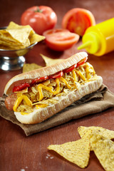 Hot dog with corn chips. Junk food