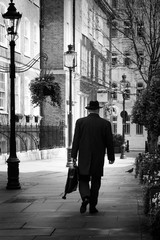 Man with hat walking in London Street