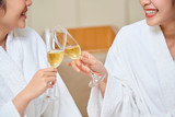 Women with champagne during spa procedure
