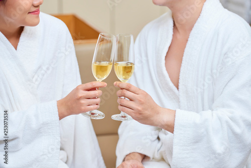 Couple with champagne in wellness centre