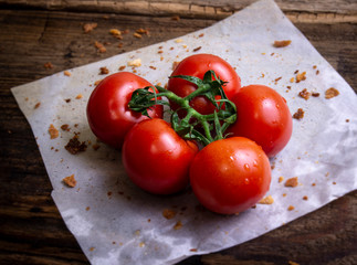 Cherry tomatoes on rustic background