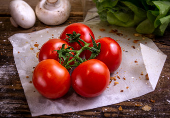 Cherry tomatoes on rustic background