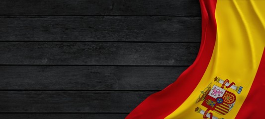 Flag of Spain, fabric on dark wood. - obrazy, fototapety, plakaty