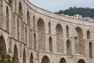 Fototapeta na wymiar Ruins of medieval aqueduct in city of Kavala, East Macedonia and Thrace, Greece