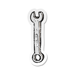 retro distressed sticker of a cartoon spanner