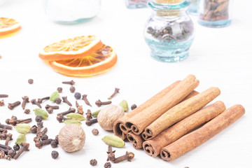Different kind of spices on wooden background.