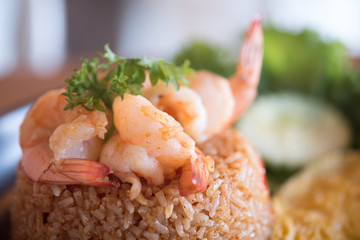 Close up of shrimp on fried rice with paste sauce