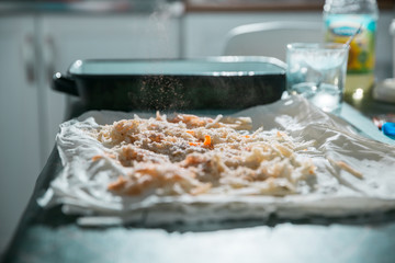 Preparation of pumpkin and apple pie with phyllo crust.