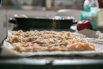 Preparation of pumpkin and apple pie with phyllo crust.