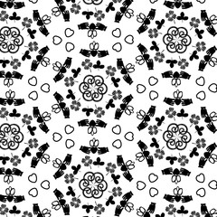 Black and white geometric hexagonal Irish symbols pattern background with Claddagh ring, spirals, hearts and shamrocks.