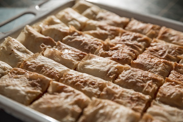 Preparation of pumpkin and apple pie with phyllo crust.