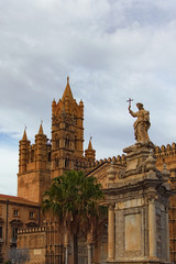 Sculpture in front of Palermo Cathedral. Medieval Cathedral built in Arab-Norman architectural style. Travel and tourism concept. Palermo, Sicily, Italy
