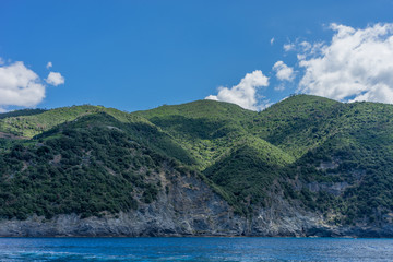 Fototapeta na wymiar Italy, Cinque Terre, Monterosso, a body of water with a mountain in the background