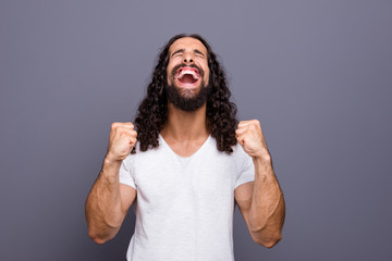 Portrait of his he nice cool attractive cheerful cheery crazy optimistic wavy-haired guy fan showing win gesture great opened mouth delight isolated over gray violet purple pastel background