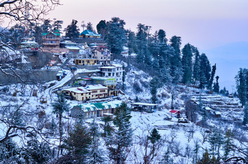 View of Kufri village 15 Kms above Shimla, Himachal Pradesh, India at sunset. It is a popular winter getaway where people come to enjoy snowfall, skiing and winter sports. 