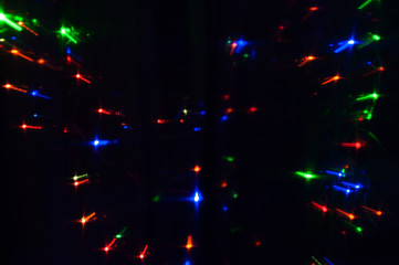 Abstract background of blurred varicolored lights.