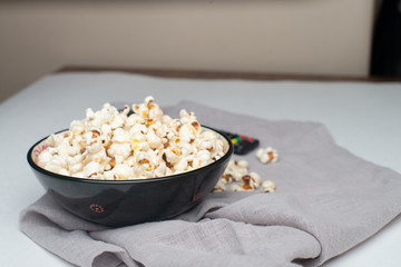Popcorn in bowl on white background
