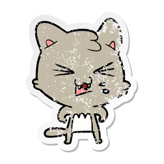 distressed sticker of a cartoon hissing cat