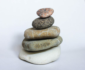 stack of stones on white background