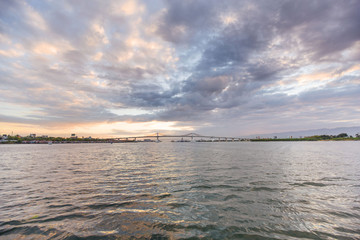 two mactaqn bridges viewpoint from open sea site in dusk sunset with cloudy sky