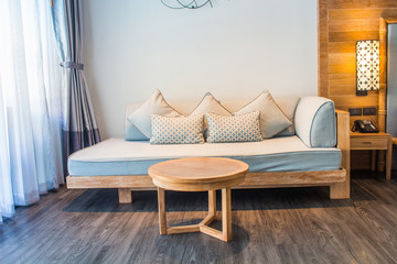 White stylish minimalist room with sofa. Parquet wood interior design