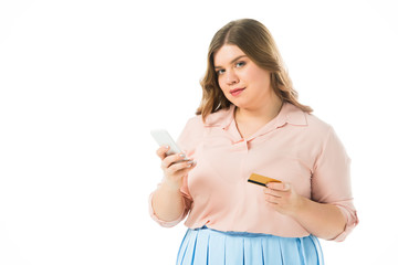 confident elegant plus size woman holding smartphone and credit card isolated on white