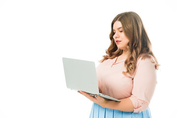 Fototapeta premium attractive plus size girl using laptop isolated on white