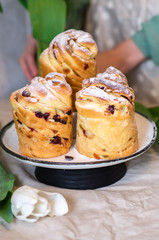 Easter cake. Kruffin sweet pastry decorated powdered sugar. Easter table with white tulips.