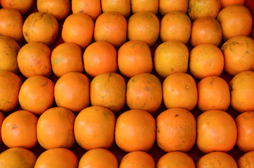 Rich in Vitamin C, orange is a popular fruit across the globe. The photo shows oranges neatly arranged in rows at a street vendor shop in Delhi, India