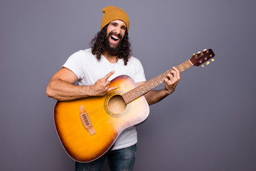 Portrait of his he nice cool crazy handsome attractive cheerful cheery wavy-haired guy playing...