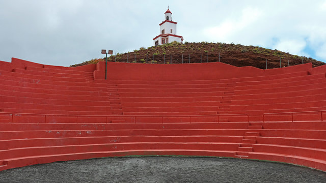 Empty wrestling arena with striking red seats used for the traditional fighting known as lucha Canarias or Canarian wrestling, in La Frontera in the El Golfo Valley, El Hierro, Canary Islands, Spain