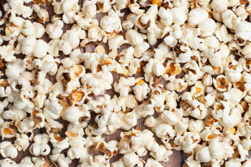 Fresh made Popcorn on an old and rustic wooden table